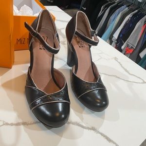 Classy black ankle strapped pumps with silver detail